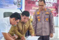 Penandatanganan MoU antara Kadisnaker Malut DR. Marwan Polosiri dan Kapolresta Tidore Kepulauan Kombespol. Yury Nurhidayat. 