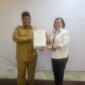 Kepala Disnakertrans Malut, Marwan Polisiri dan Deputi Direksi Kedeputian Wilayah X BPJS Kesehatan, Octovianus Ramba.