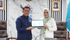 Dr. Herman, M.Si, Deputi Bidang Pembinaan Penyelenggaraan Manajemen ASN BKN RI bersama Bupati Kepulauan Sula, Fifian Adeningsi Mus.