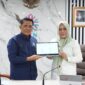Dr. Herman, M.Si, Deputi Bidang Pembinaan Penyelenggaraan Manajemen ASN BKN RI bersama Bupati Kepulauan Sula, Fifian Adeningsi Mus.